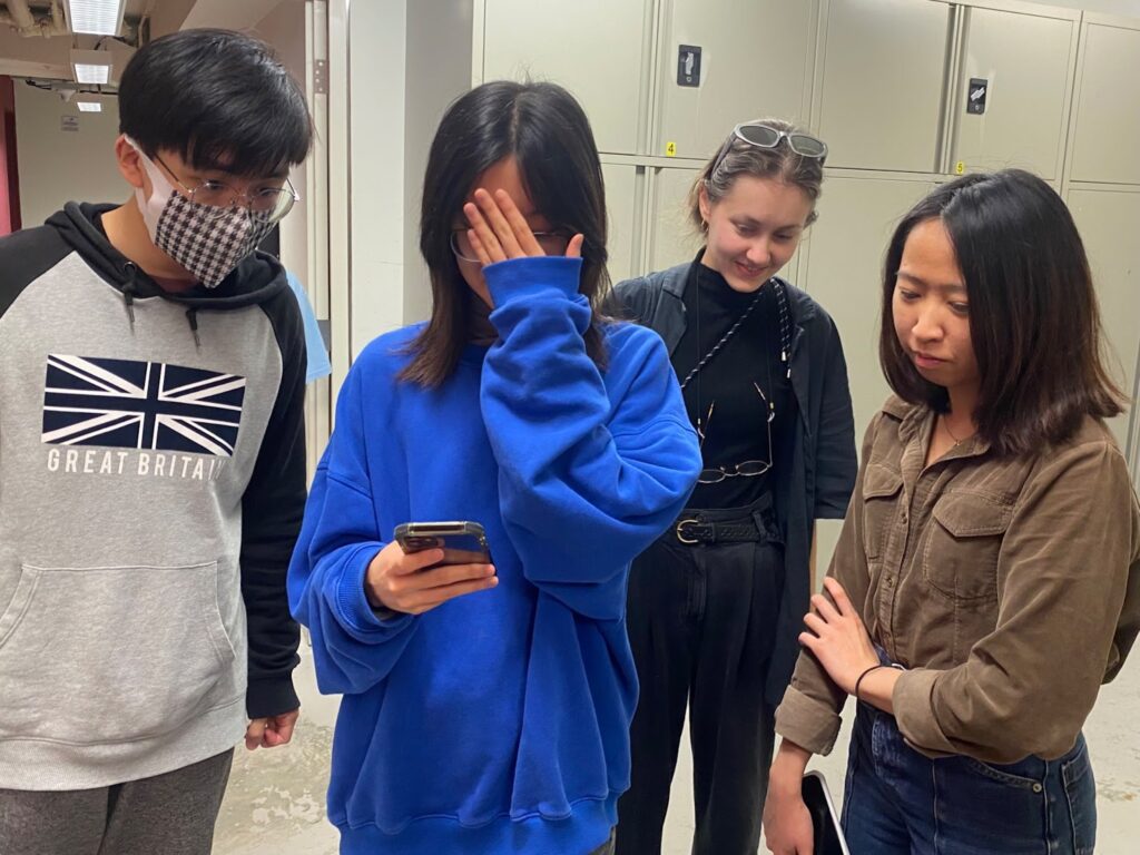 photos of audiences walking around the sound installation site and using their portable devices to play with the installation