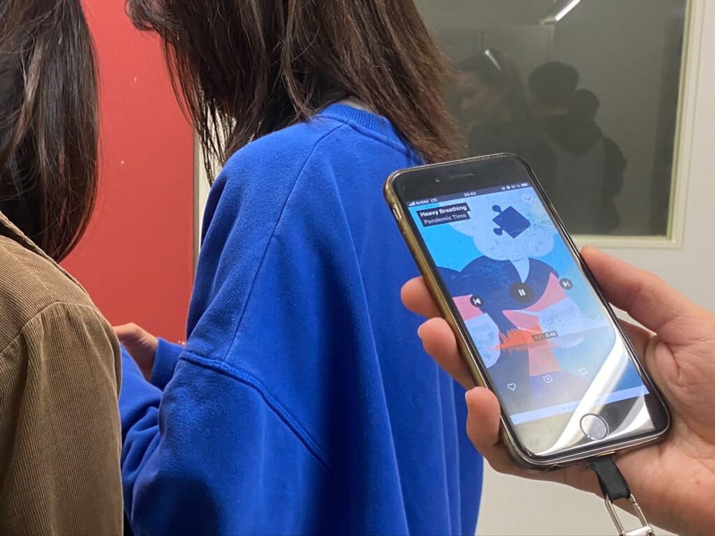 photos of audiences walking around the sound installation site and using their portable devices to play with the installation