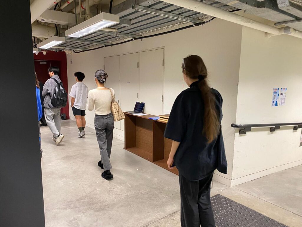 photos of audiences walking around the sound installation site and using their portable devices to play with the installation